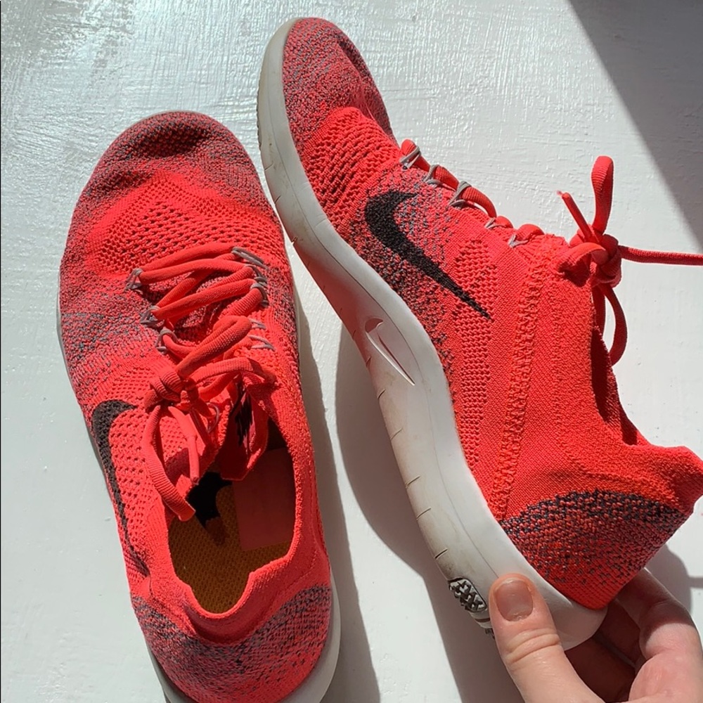 Bright Pink Nike Flyknit shoes